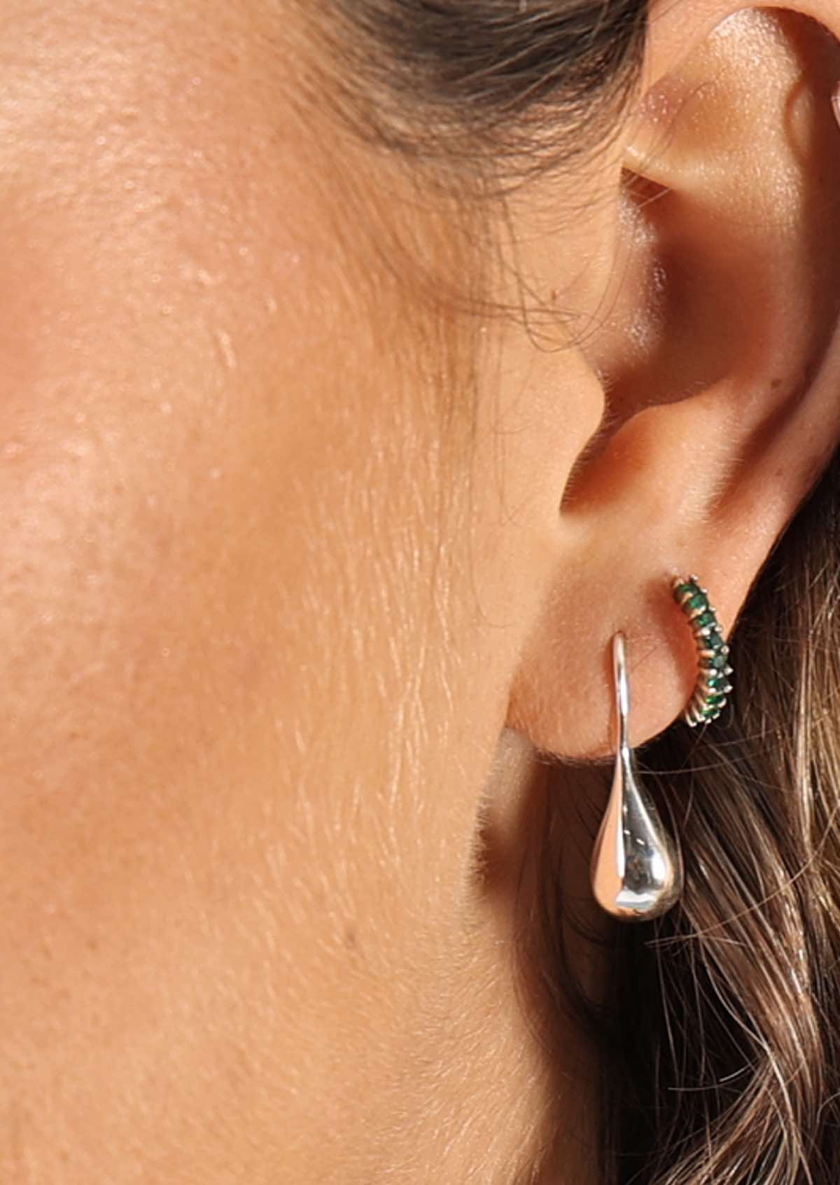 Womans ear with sterling silver Droplet Earrings