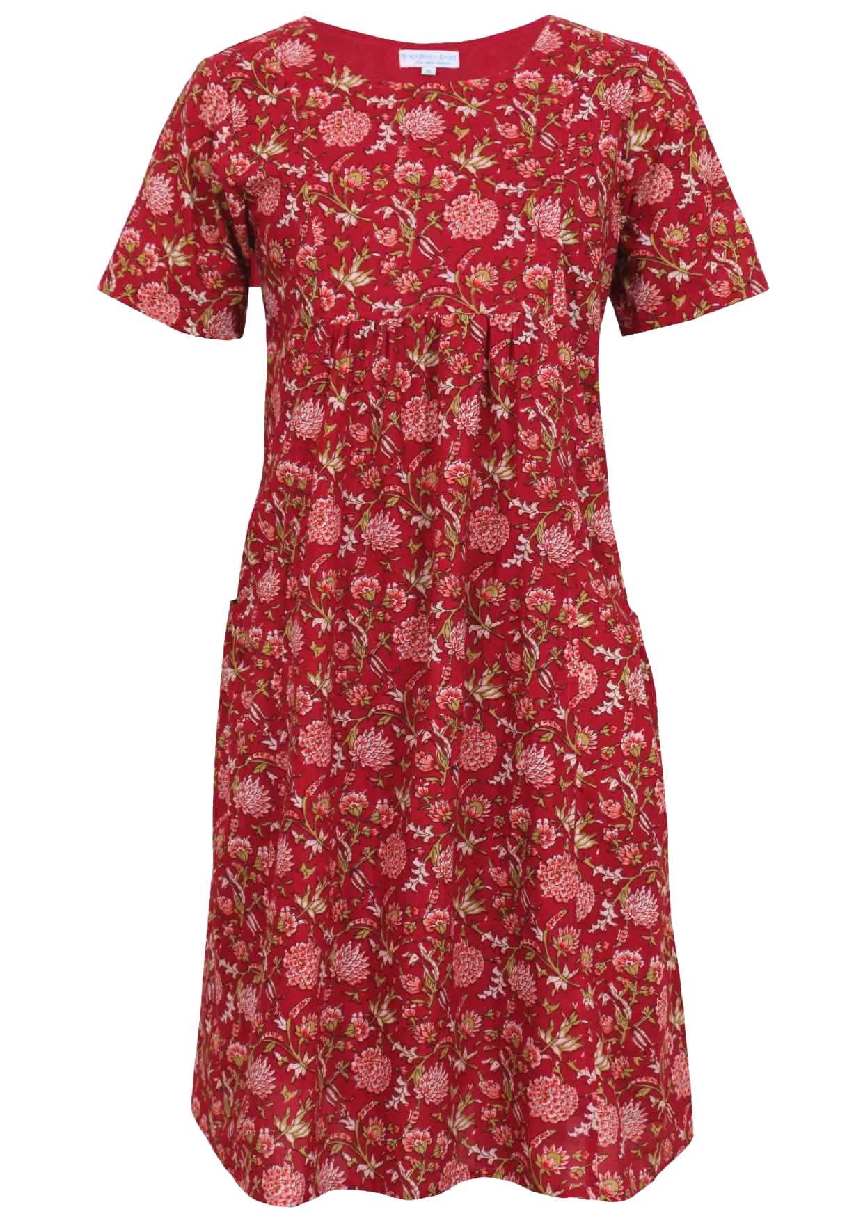 Front mannequin photo of short sleeve cotton sun dress in floral print on cranberry base, with gathers under bust and deep pockets