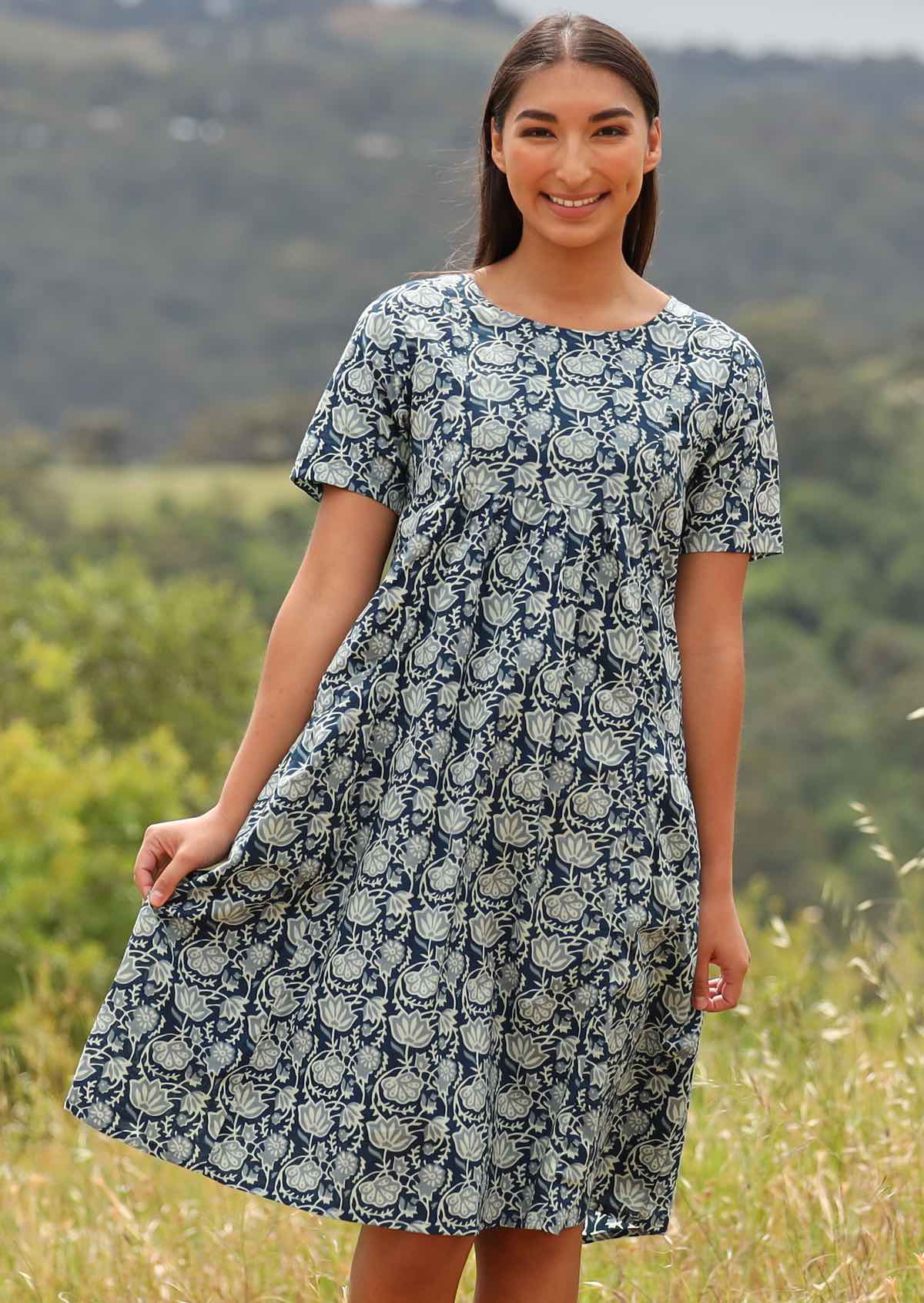 Model wears 100% cotton dress with short sleeves.