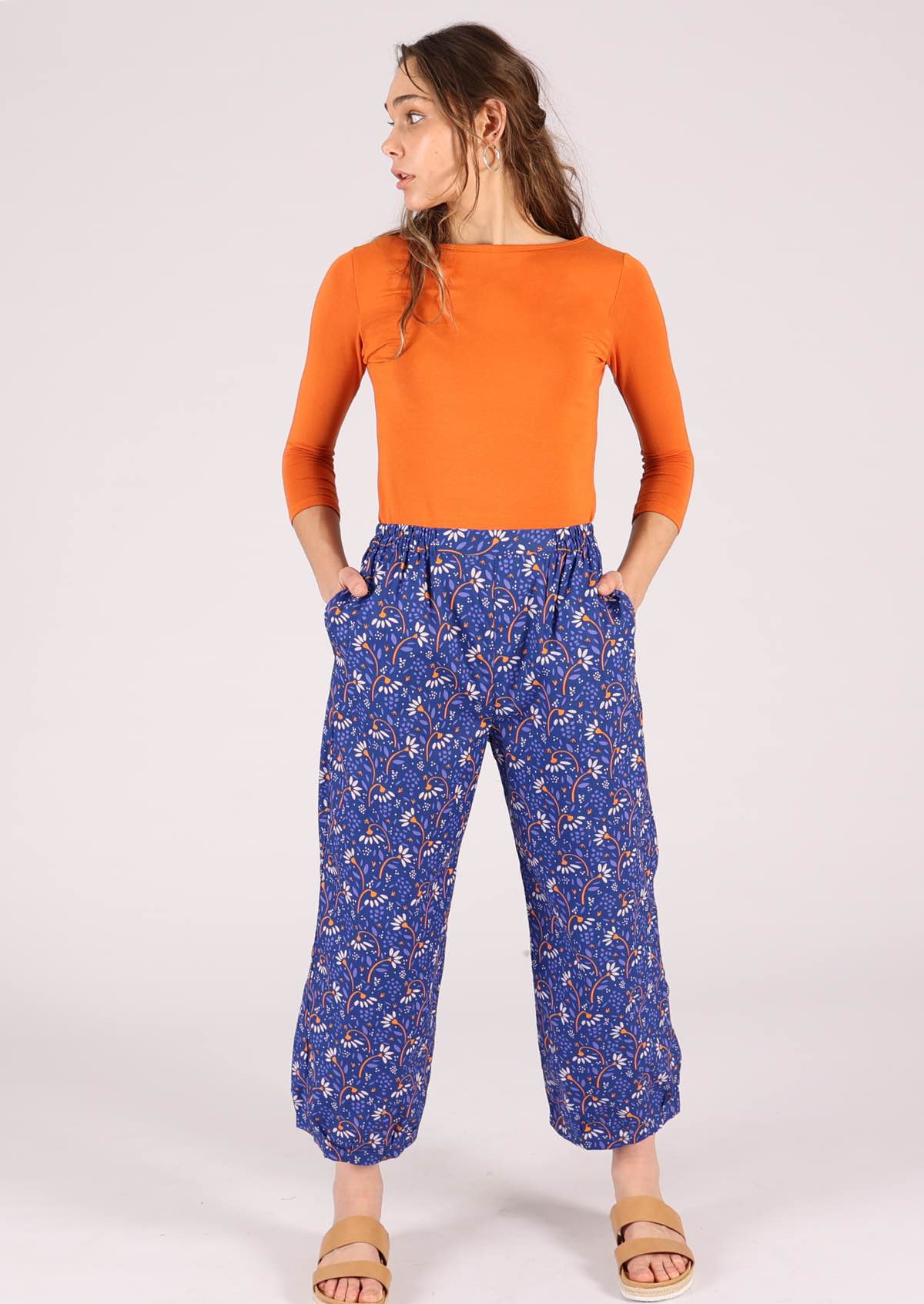 high waisted pants with daisy print on vibrant blue base