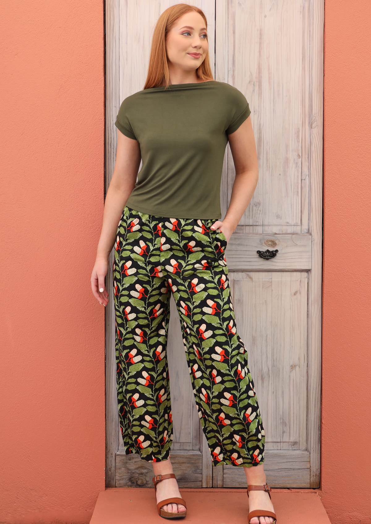 Model wears botanical print cotton wide leg pants with pockets