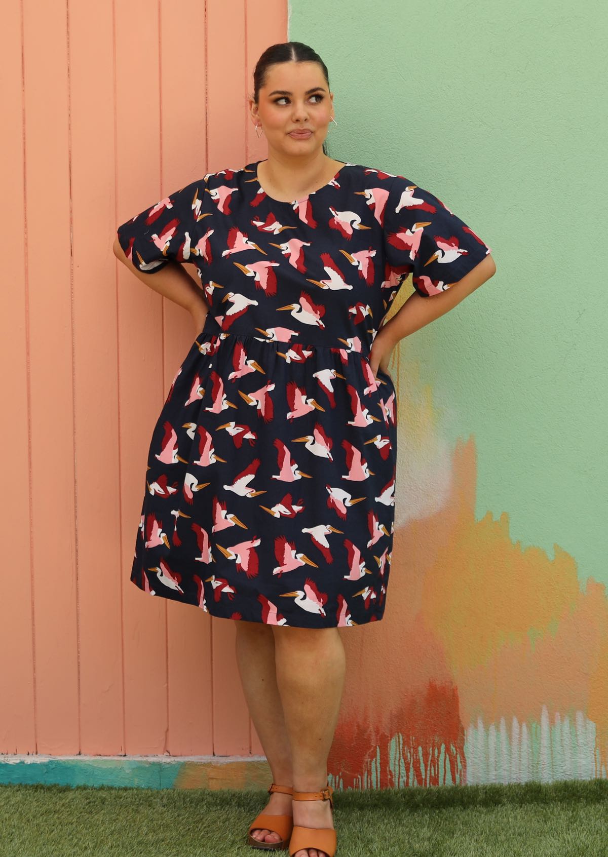 woman wearing plus sized cotton dress navy blue with bird print