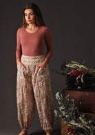 A model wears loose fitting cotton pants
