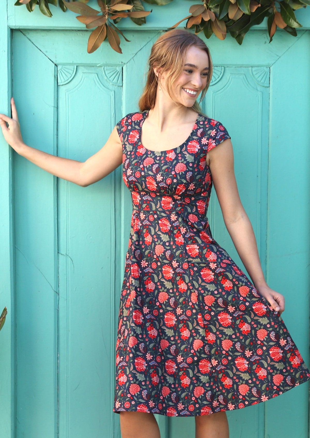 100% cotton dress in beautiful bright floral print with scoop neck and short cap sleeves.