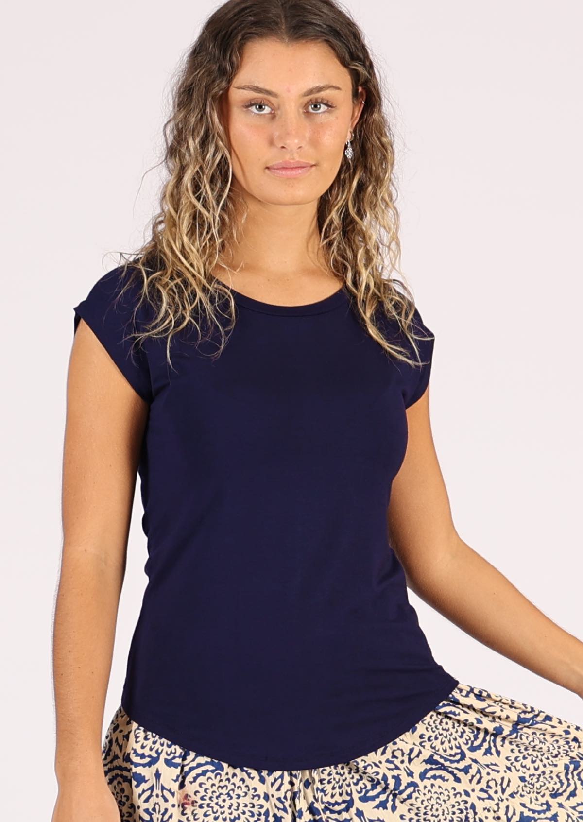 Woman wearing a soft flattering fit navy blue rayon jersey t-shirt.