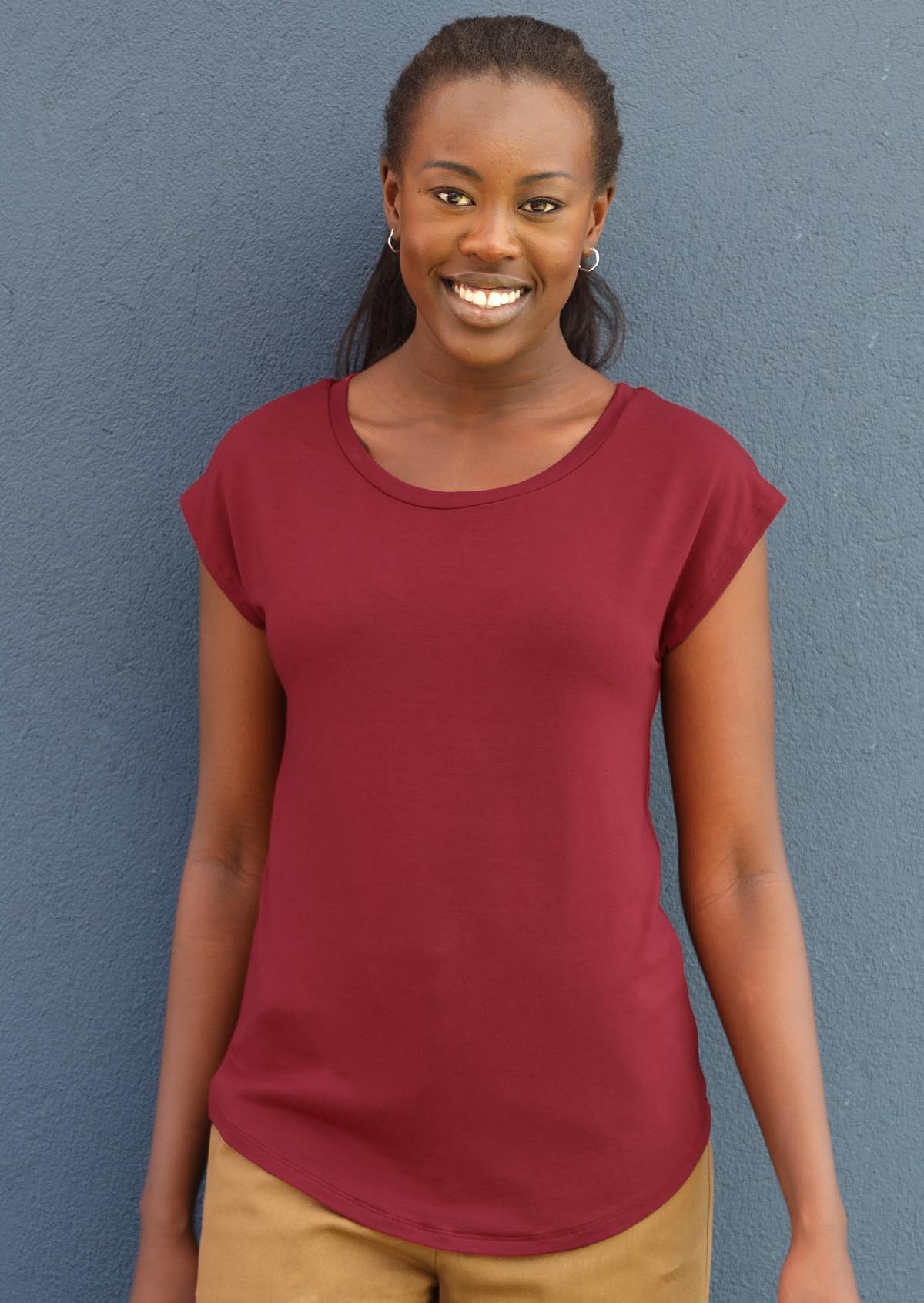 Woman wearing a soft flattering fit maroon rayon jersey t-shirt.