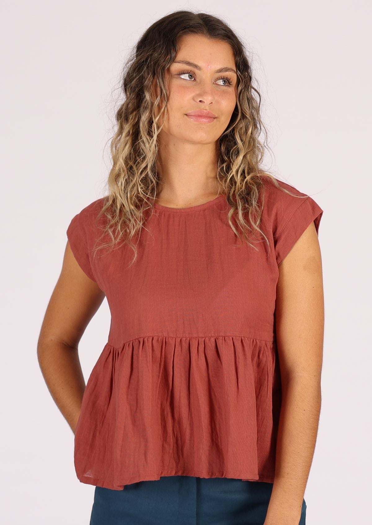 Cotton gauze terracotta coloured top with ruffle all around