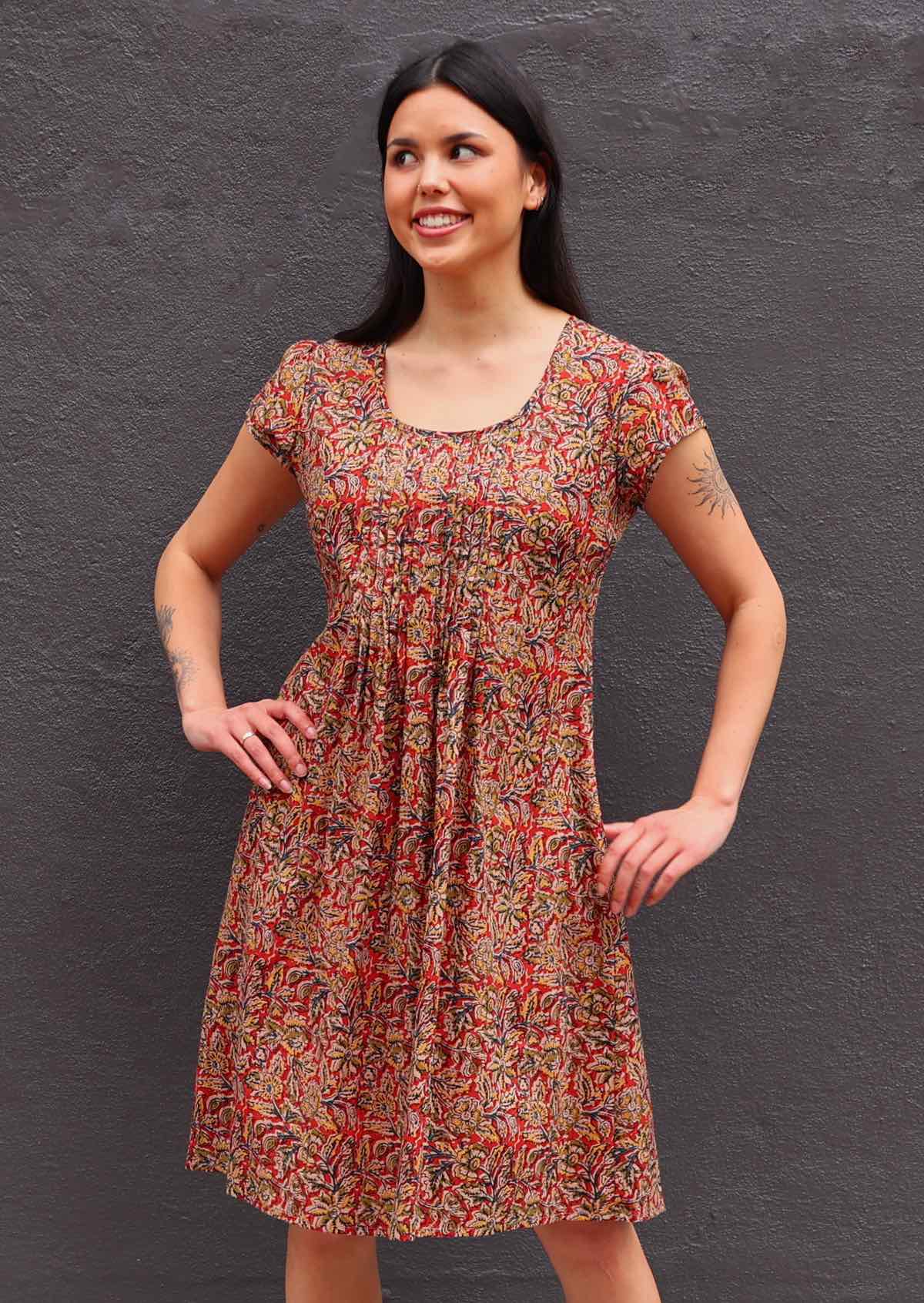 Woman with dark hair Indian print cotton sundress