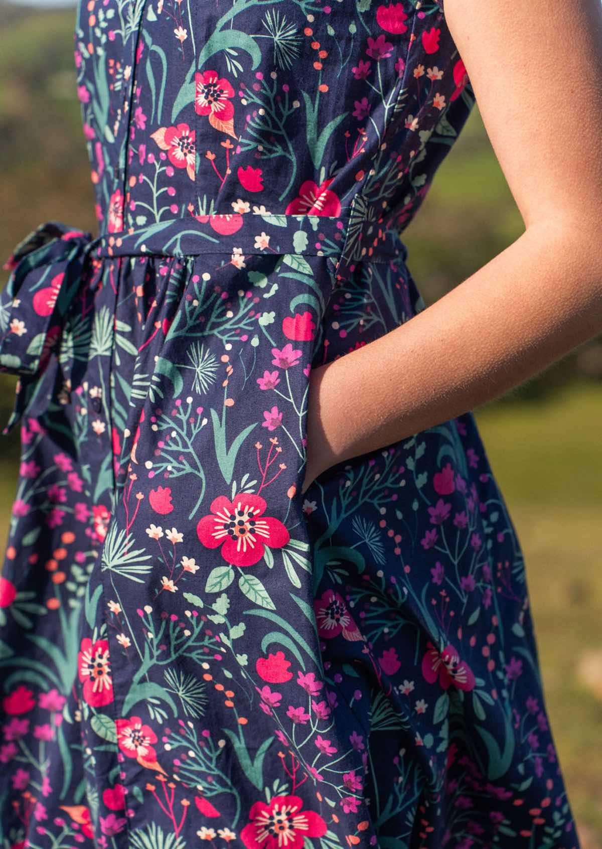 close up of hands in pockets of Vivien Dress navy cotton