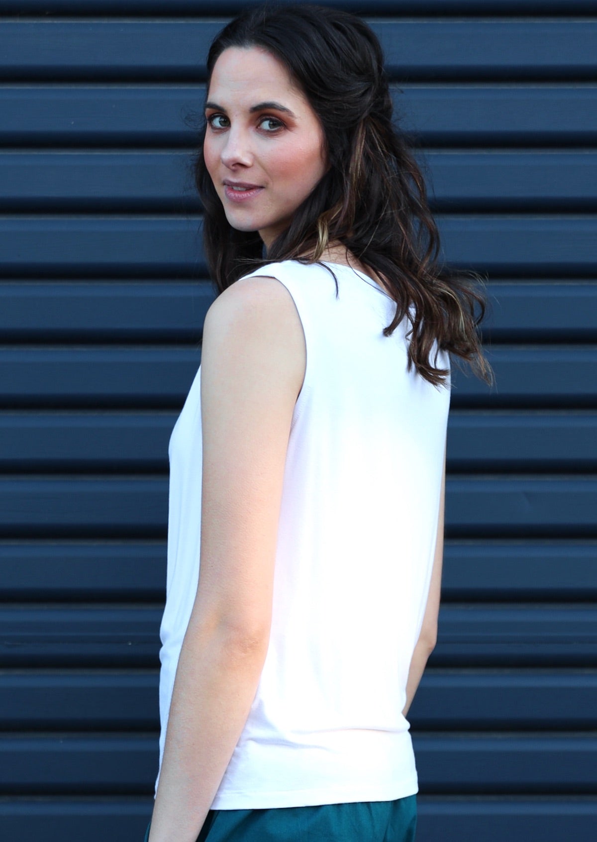Back view of woman wearing rayon white basic top