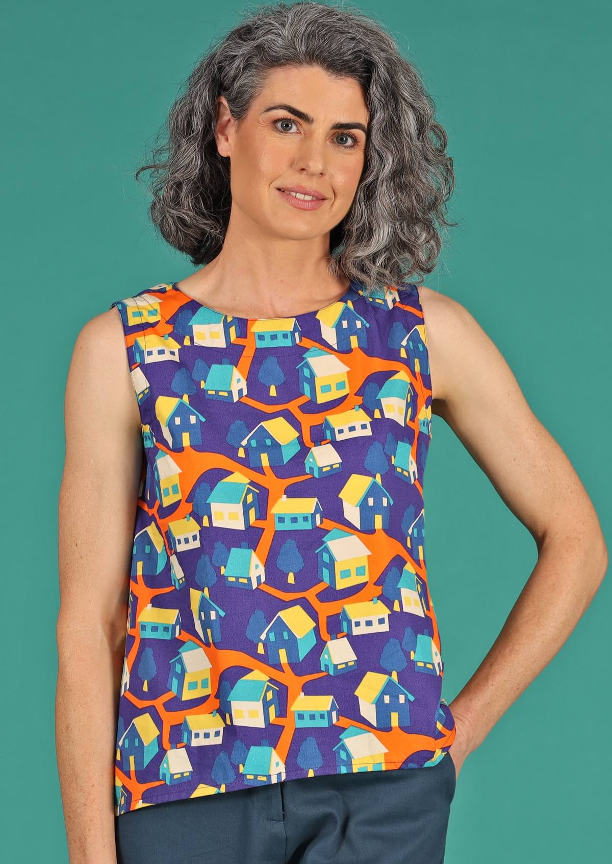 Eden Top sleeveless round neckline a-line fit with slight concave hem 100% cotton blue background orange blue yellow houses print | Karma East Australia