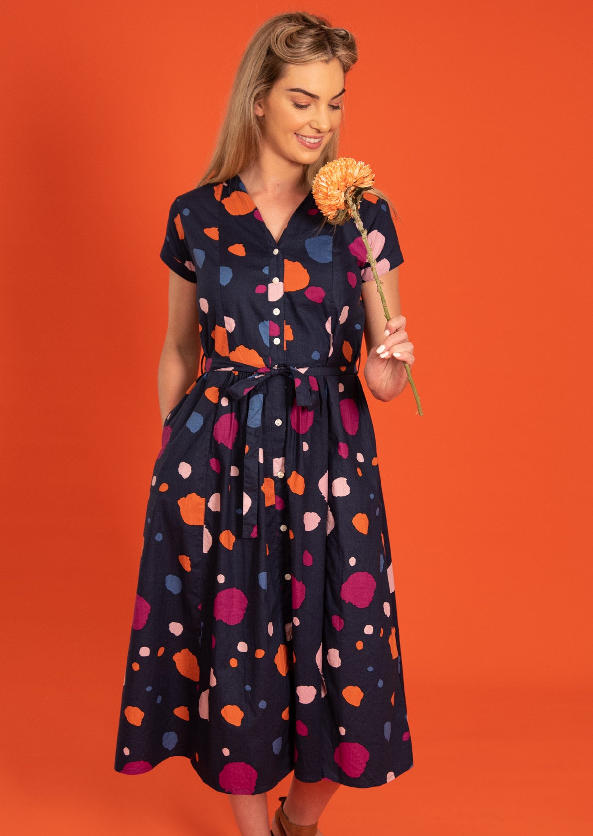 Vivien Dress 50s retro inspired Full Button Down midi dress short sleeve high neckline waist-tie Womens Dress with side pockets 100% cotton with dark navy background coloured spots print | Karma East Australia