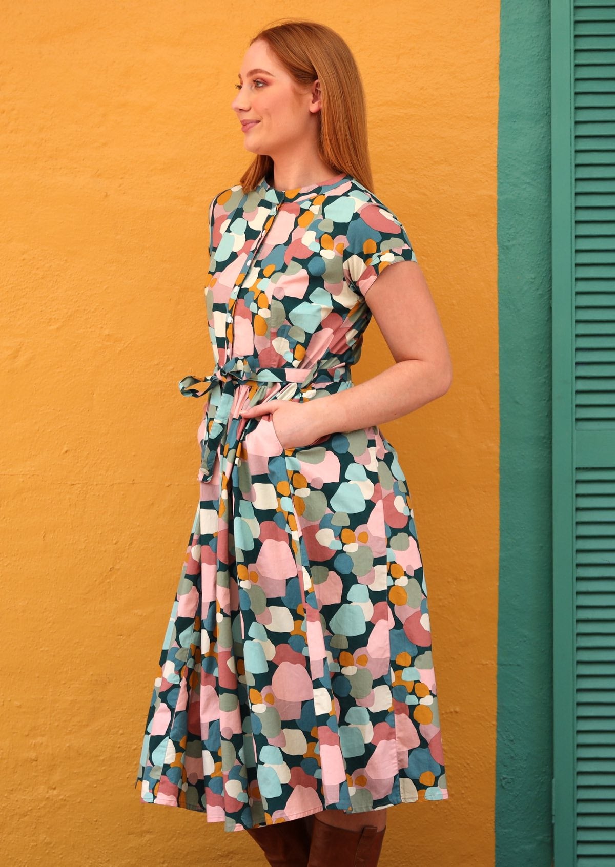 high neckline front button up closure from neckline to hem