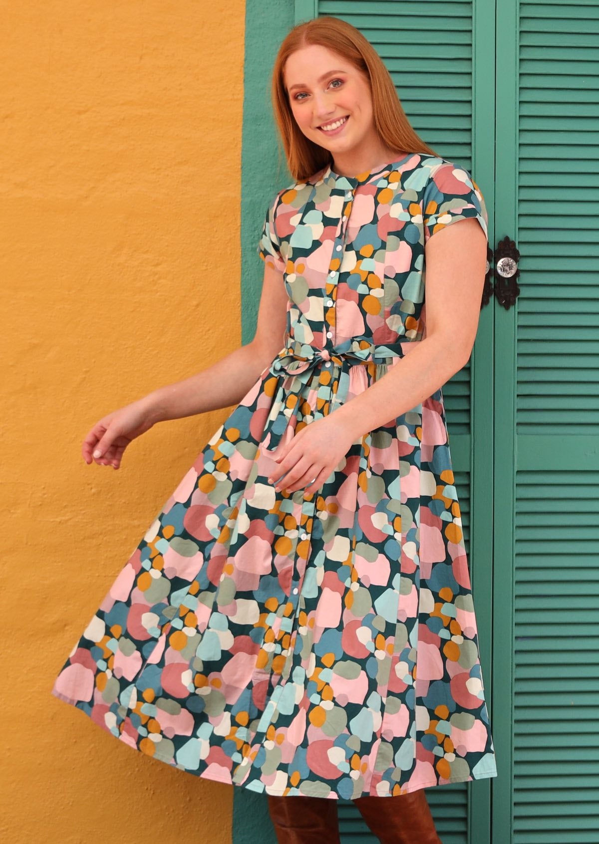 Vivien Dress 50s retro inspired Full Button Down midi dress short sleeve high neckline waist-tie Womens Dress with side pockets 100% cotton with teal background and pastel coloured spots print | Karma East Australia