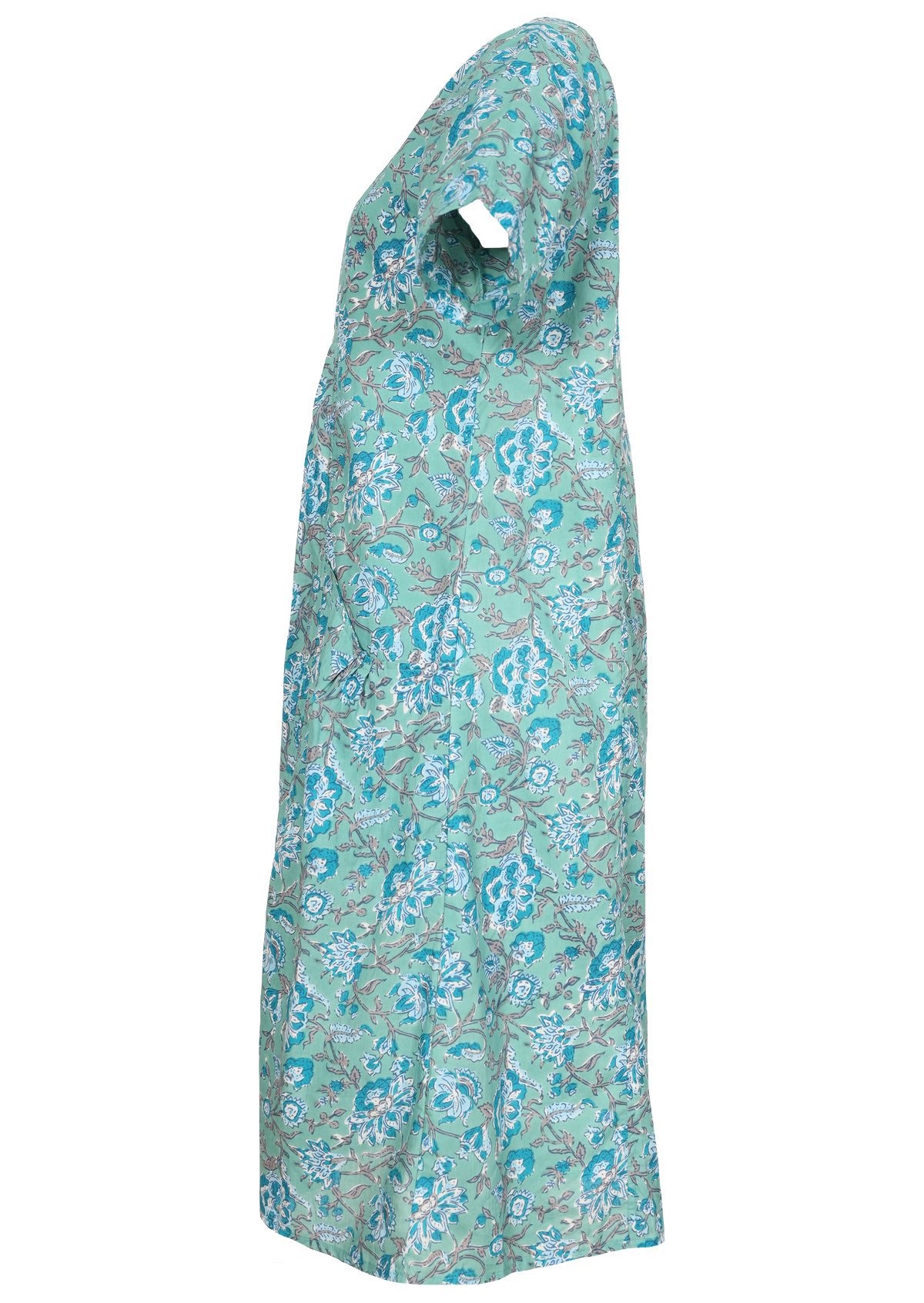 Side view of knee length cotton dress with short sleeves in indian floral print.