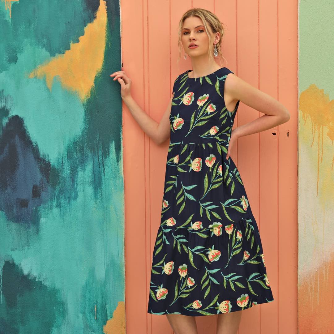 woman wearing navy blue floral maxi dress