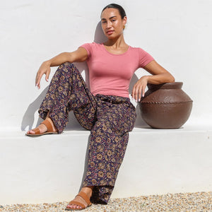 woman wearing khaki green cotton drill pants and floral cotton blouse