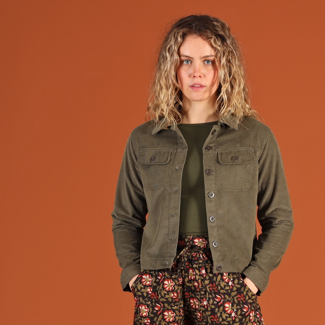 woman wearing khaki green corduroy jacket