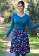 Woman wears knee length A-line skirt