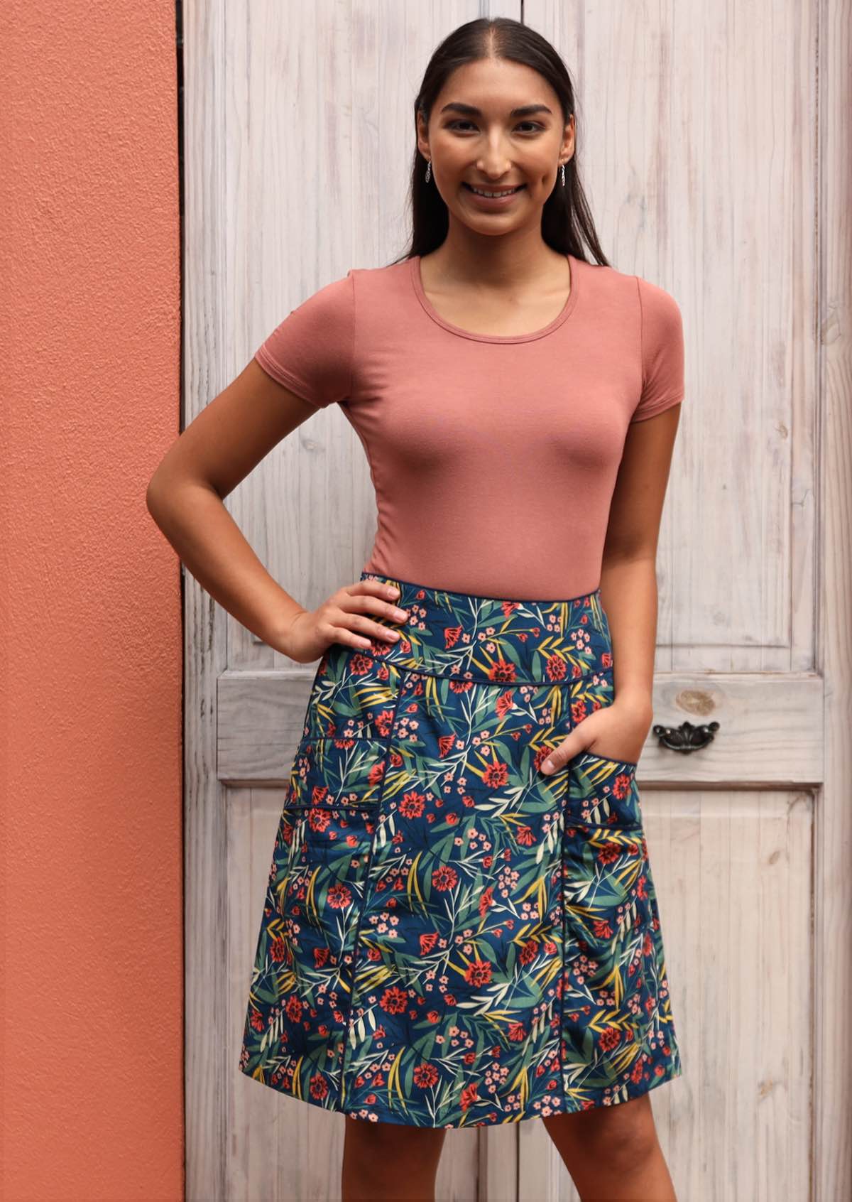 Smiling model wears A-line skirt. 