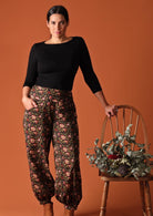 Acapulco Pants Wild Rose 100% cotton black and olive green floral print harem pant with button ankle and pockets | Karma East Australia