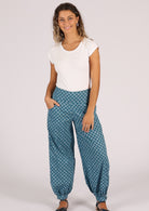 Cotton pants with wide yoke at front of waistband and pockets