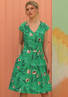 Model wears floral print mint green retro style dress