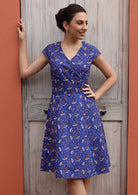 Retro cotton dress with orange and white floral  print on vibrant blue base
