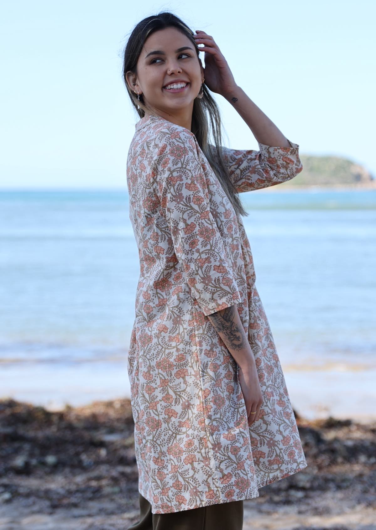 Model wears 100% cotton tunic in peach floral print