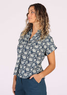 woman wearing floral print cotton blouse with collar
