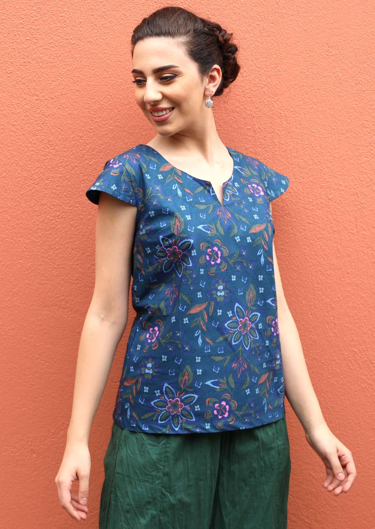 Model wears 100% cotton top with cap sleeves. 