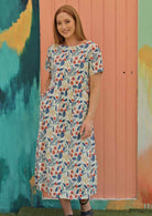 Model wears loose fit floral cotton lined dress
