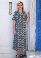 Woman is wearing a 100% cotton dress that is lined from the waistband down. 
