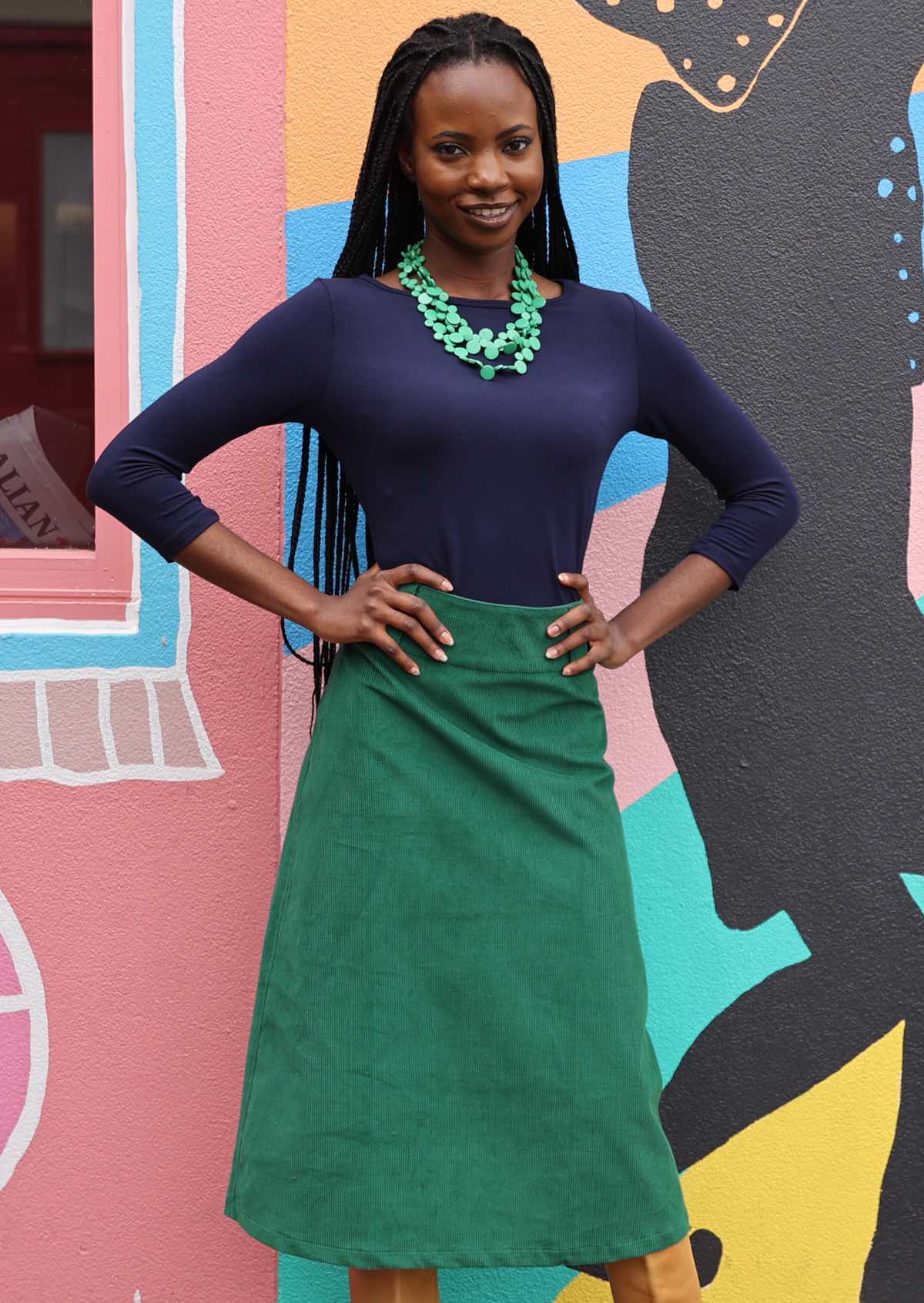 Green cotton corduroy A-line skirt with back pockets