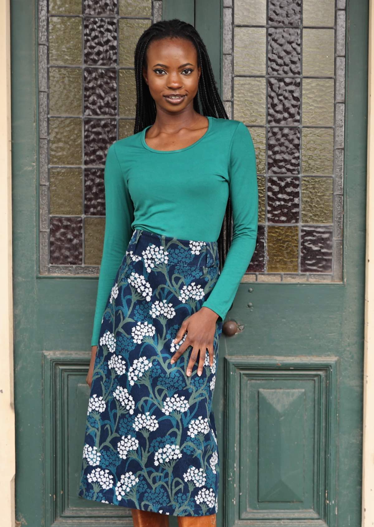 A-line midi length corduroy skirt with belt loops and back pockets