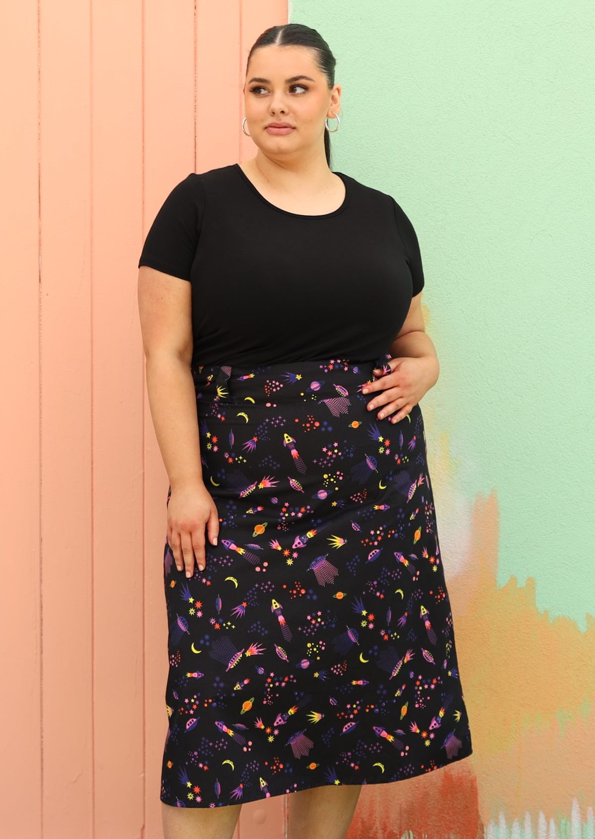 Curve sized woman wearing black space print cotton aline skirt