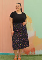 Curve sized woman wearing black cotton aline skirt