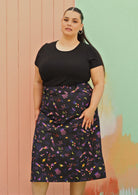 Curve sized woman wearing black space print cotton skirt