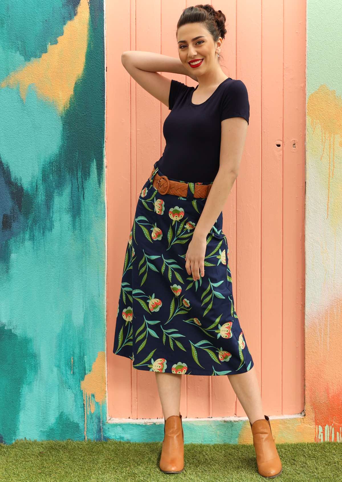 Model wears 100% cotton skirt with back pockets. 