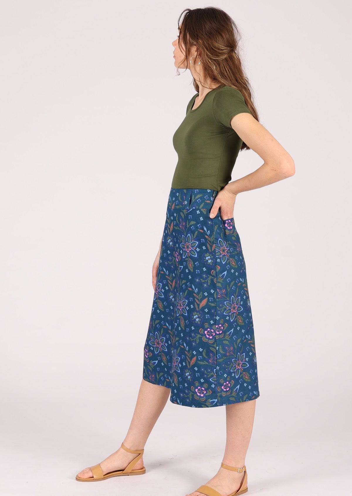 Model wears 100% cotton A-line skirt with a wide waistband yoke. 