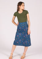 100% Cotton skirt features a blue base with a green, orange and pink floral pattern. 