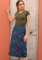 100% cotton skirt with a floral print on a blue base. 