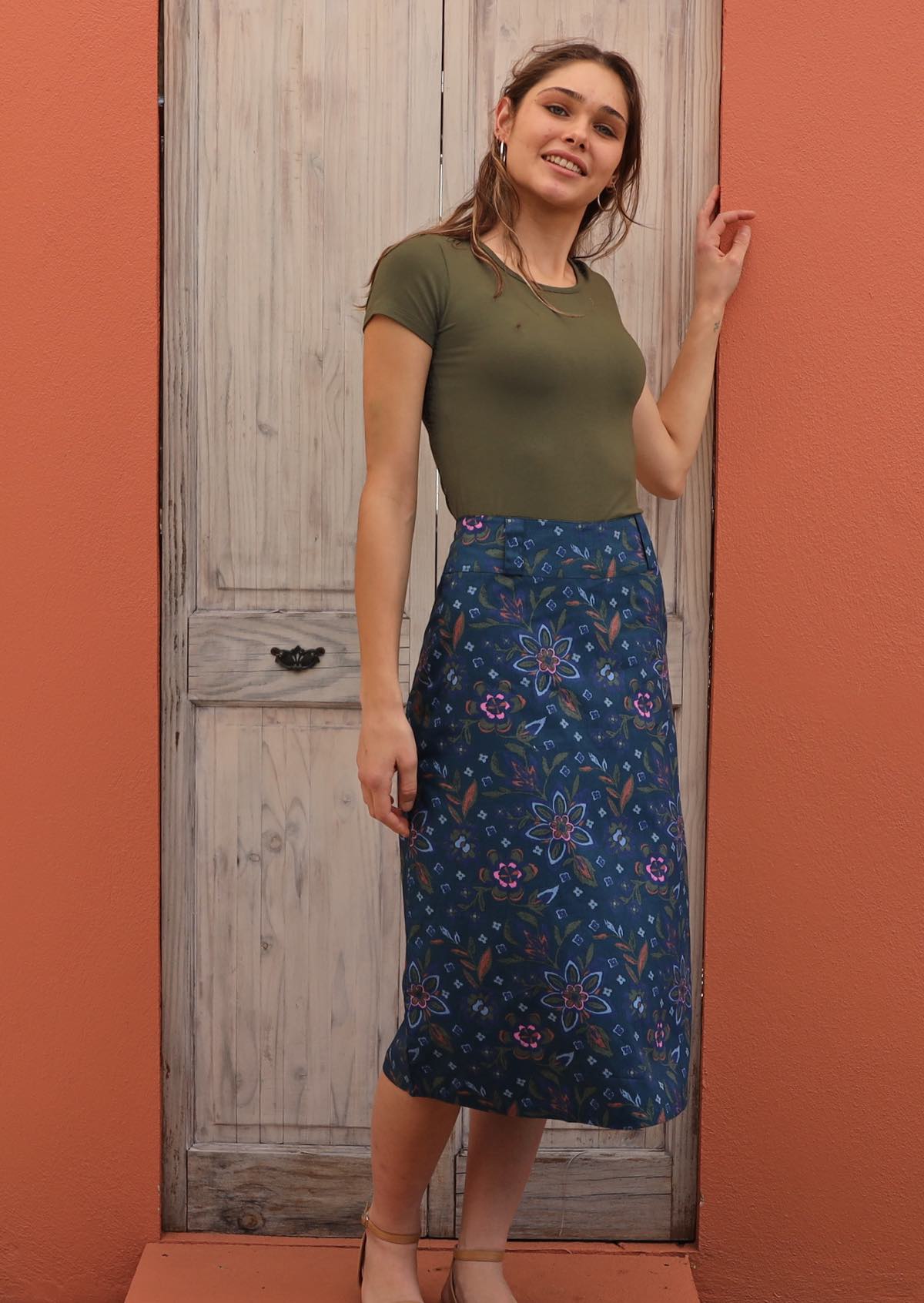Model wears 100% cotton midi skirt with back pockets. 