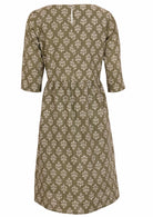Cotton dress in sweet green has button closure at nape of neck to ease with dressing