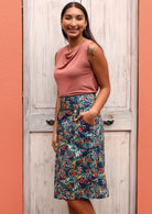 Model wears cotton skirt with a piping trim. 