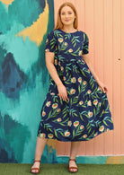Model wears relaxed fit cotton floral dress with 