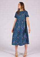 100% cotton blue tiered dress that ends below the knee. 