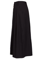 Side view of 100% cotton black maxi skirt with belt loops, side pockets and box pleats at front and back 