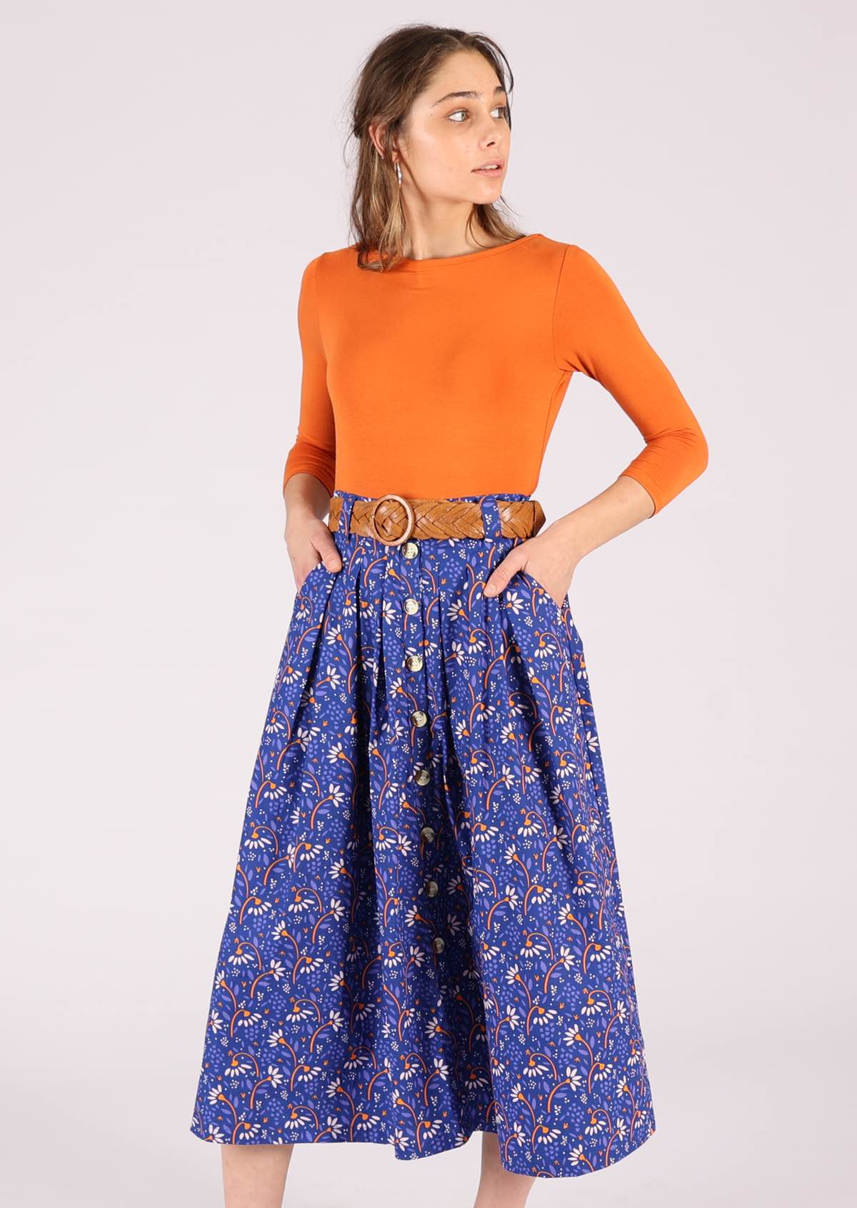 Model wears midi length 100% cotton skirt in blue 