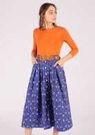 Model wears midi length 100% cotton skirt in blue 